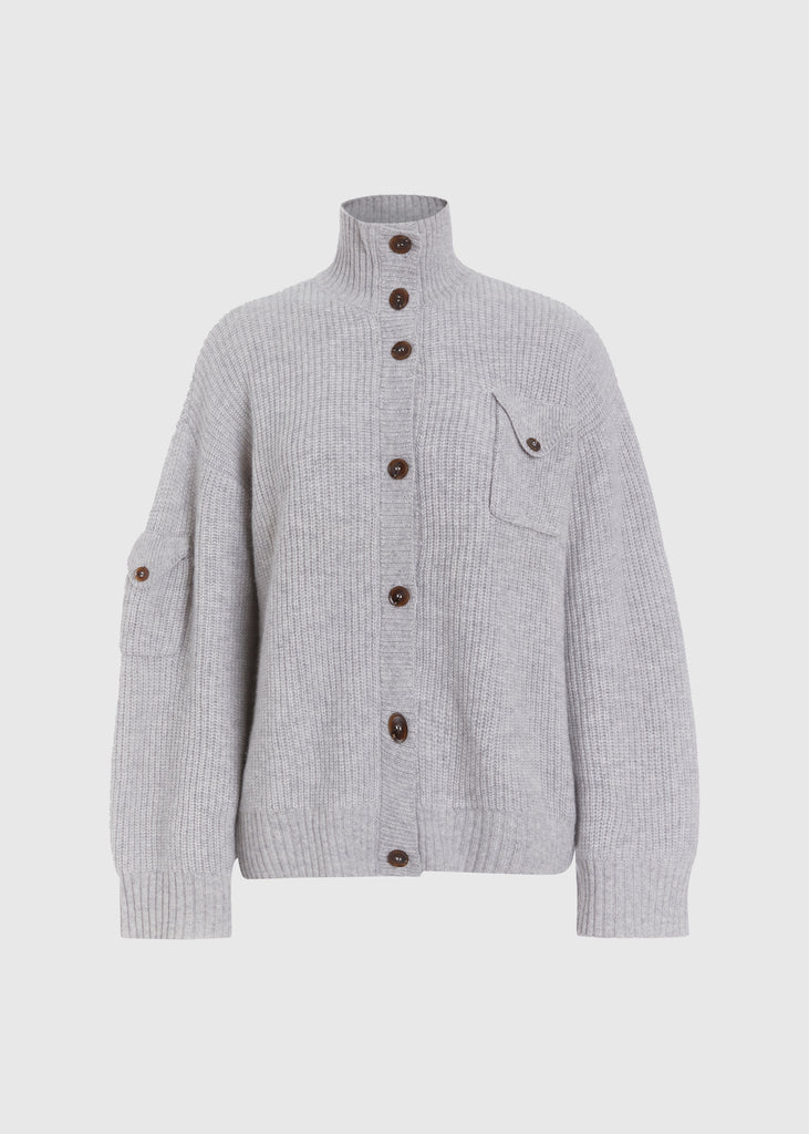 Heather Grey Graham Cardigan This 100% royal cashmere cardigan features an oversized silhouette that hits below the hip, perfect for layering. Features horn buttons along with pockets at chest and right sleeve. Can be worn open or buttoned up as a turtleneck.