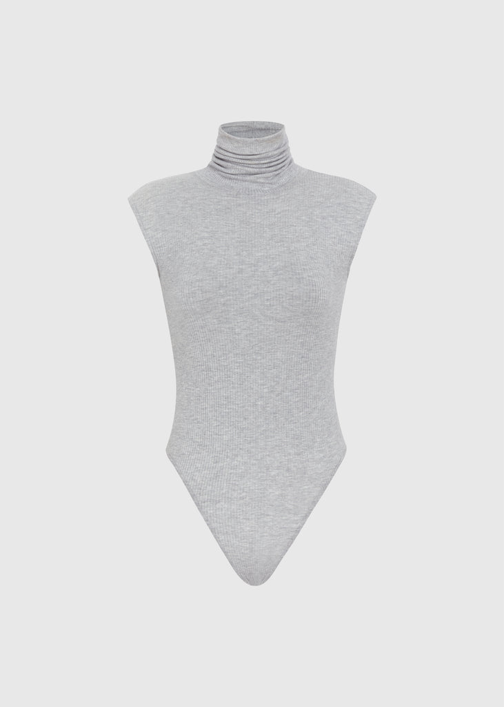 Light Grey Penny Bodysuit This buttery soft sleeveless ribbed turtleneck bodysuit showcases a sleek silhouette for a versatile wardrobe staple.Styled with The Kat Trouser | The Duke JoggerFINAL SALE 