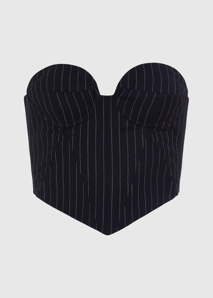 Navy Pinstripe Ronnie Corset | The Archive This tailored strapless corset features a fitted suiting bodice with contoured boning, moldable wiring at cups, and shirred back panels to ensure a snug yet flexible fit. Slightly cropped with a v-front silhouette.Styled with The Ronnie Blazer | The Ronnie Trouser | The Ronnie SkirtAll items within The Archive Collection are FINAL SALE.Subscribe to our newsletter to unlock an additional offer exclusive to the archive sale.