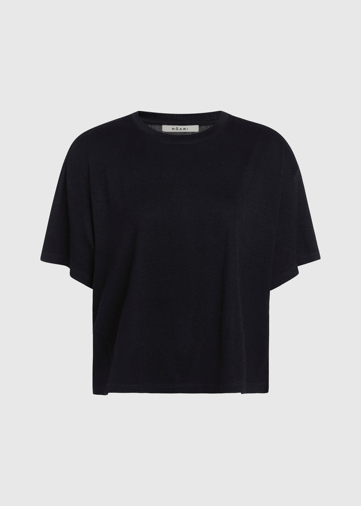 Black Zoey Tee This tee crafted from premium merino wool features an oversized relaxed silhouette and a lightly sheer finish.Styled with The Ashley Pant