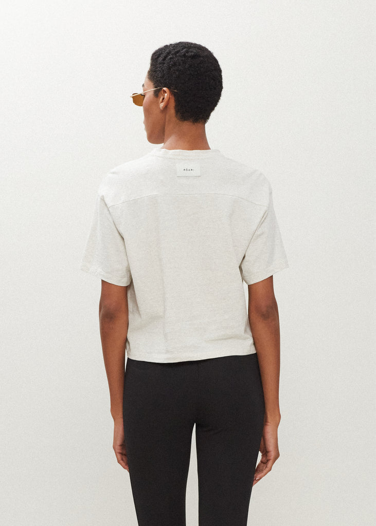 Light Grey Danny Tee An oversized drop shoulder t-shirt made from 100% lightweight cotton featuring a silk RŌARI branded patch at back of neck. Cut with a semi-cropped boxy fit.