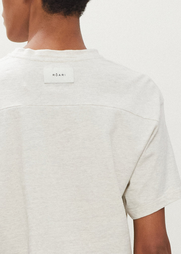 Light Grey Danny Tee An oversized drop shoulder t-shirt made from 100% lightweight cotton featuring a silk RŌARI branded patch at back of neck. Cut with a semi-cropped boxy fit.