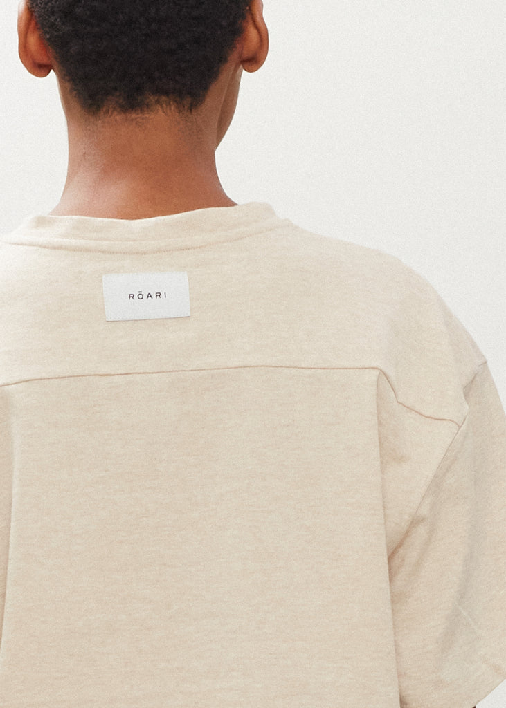 Oatmeal Danny Tee An oversized drop shoulder t-shirt made from 100% lightweight cotton featuring a silk RŌARI branded patch at back of neck. Cut with a semi-cropped boxy fit.