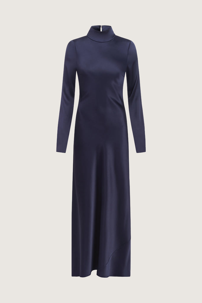 Navy Florence Dress This long sleeved satin gown is coveted for its fluid, liquid-like drape and movement. It is distinguished by a cowl turtleneck silhouette and plunging open back cutout. Includes 2 gold chain belts.Styling tip: Option to wear belt wrapped as a bracelet, or as a lariat cascading down the open back.Brittany is 5’10” and wearing a size XS.