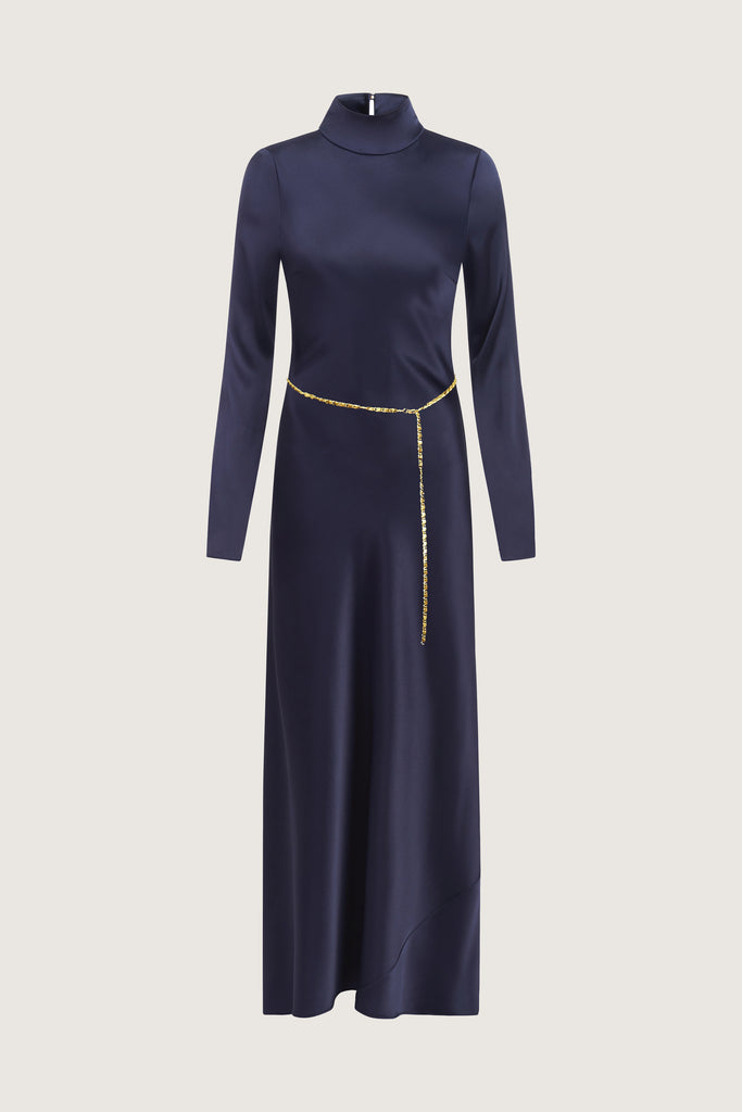 Navy Florence Dress This long sleeved satin gown is coveted for its fluid, liquid-like drape and movement. It is distinguished by a cowl turtleneck silhouette and plunging open back cutout. Includes 2 gold chain belts.Styling tip: Option to wear belt wrapped as a bracelet, or as a lariat cascading down the open back. *Please reference our return & exchange policy for Sale & Archived items.