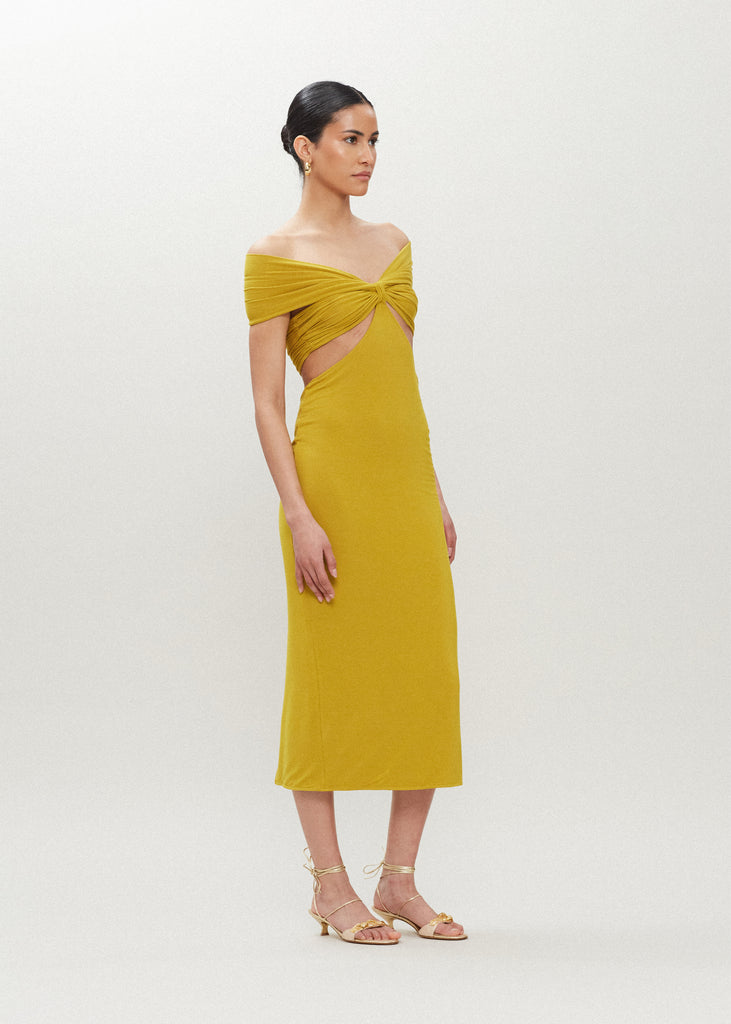 Palm Gold Jamie Dress Carefully draped stretch modal creates this dress with cutout details, fitted double lined skirt and off shoulder neckline. Accentuates the feminine curve and flatters the silhouette.