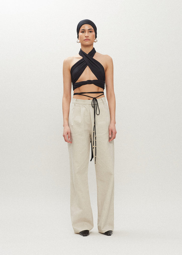 Black Jamie Wrap Create countless looks with this sustainable premium stretch modal wrap. Includes beaded piece to be paired as a belt, wrapped around neck, tied in hair....the possibilities are endless.Styled with The Louise Trouser