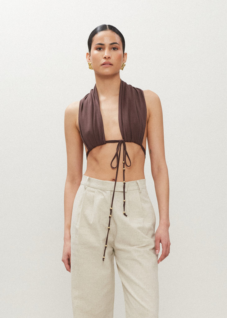 Muted Brown Jamie Wrap Create countless looks with this sustainable premium stretch modal wrap. Includes beaded piece to be paired as a belt, wrapped around neck, tied in hair....the possibilities are endless.Styled with The Louise Trouser