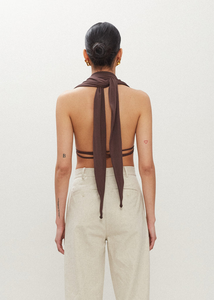 Muted Brown Jamie Wrap Create countless looks with this sustainable premium stretch modal wrap. Includes beaded piece to be paired as a belt, wrapped around neck, tied in hair....the possibilities are endless.Styled with The Louise Trouser