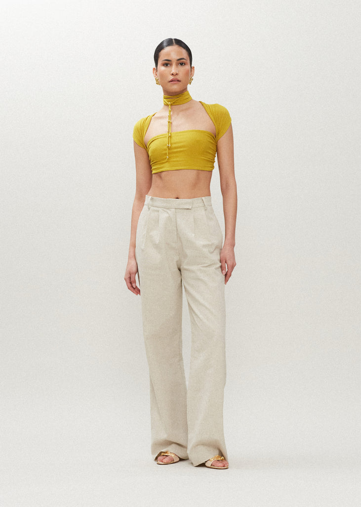 Palm Gold Jamie Wrap Create countless looks with this sustainable premium stretch modal wrap. Includes beaded piece to be paired as a belt, wrapped around neck, tied in hair....the possibilities are endless.Styled with The Louise Trouser