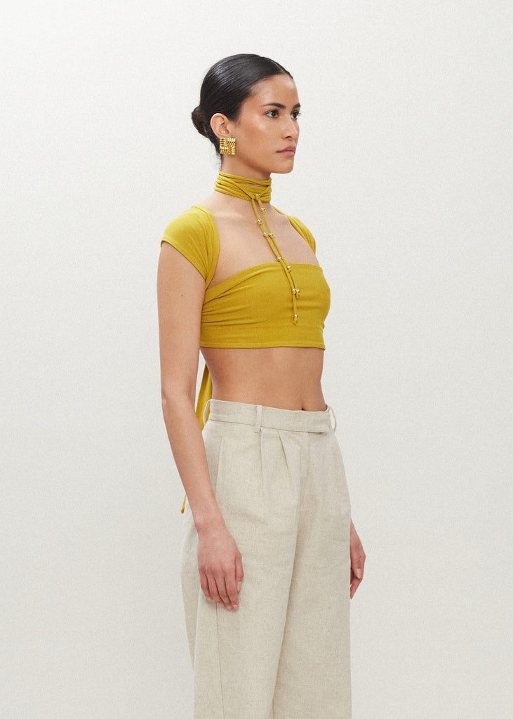 Palm Gold Jamie Wrap Create countless looks with this sustainable premium stretch modal wrap. Includes beaded piece to be paired as a belt, wrapped around neck, tied in hair....the possibilities are endless. 