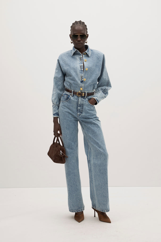 Light Indigo Jane Shirt -Dolman sleeves -Sculpted cuffs with invisible back zippers-Bound seams for durability-5-button front placket with ROARI gold knot buttons-Structured collar stand-Removable shoulder pads with snaps-Custom washed for lived-in look-ROARI gold knot buttons Anok is 5'9