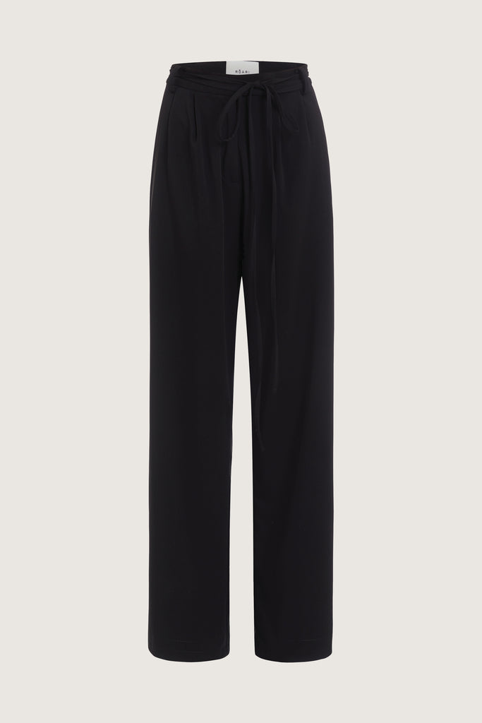 Black Kat Trouser Dual pleated mid-rise trousers featuring a straight relaxed fit, pockets at back with horn buttons, and includes a self-fabric detachable belt.  Ana is 5’9