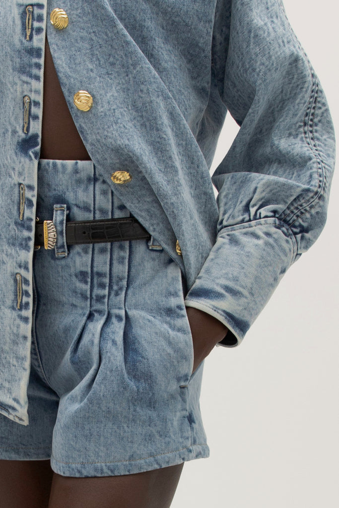 Light Indigo Kate Short -High-waisted paperbag fit-Curved hem to elongate legs-Stitched pleats at waistband-Reinforced denim belt loops-Zipper closure with clean finish-V-notch at back waist-On-seam pockets with contrast lining-Self-facing waistband with under-stitching-Overlocked interior seams-Garment custom washed for a lived-in feel Anok is 5'9