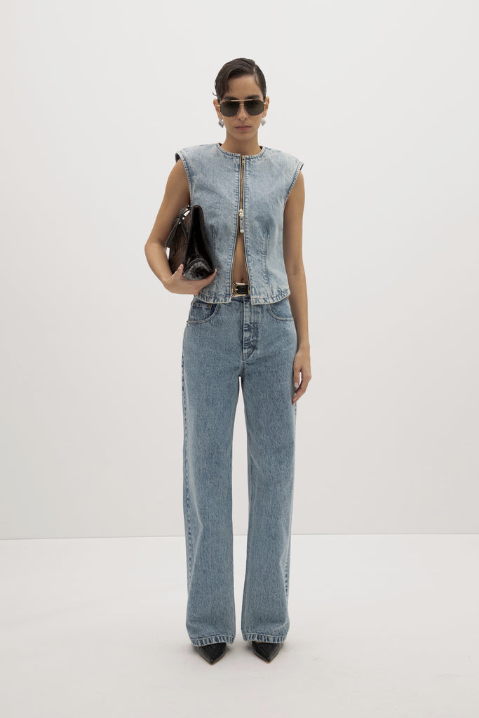 Light Indigo Jane Jean -Relaxed fit with structured feel-High-rise contoured waistband-Curved yoke for sculpted fit-Zip-fly with custom ROARI button-Flat-felled seams and double-needle stitching-Reinforced self-doubled belt loops-Functional front and back pockets-Chain stitch interior-Garment custom washed for a lived-in feel Ingryd is 5'10