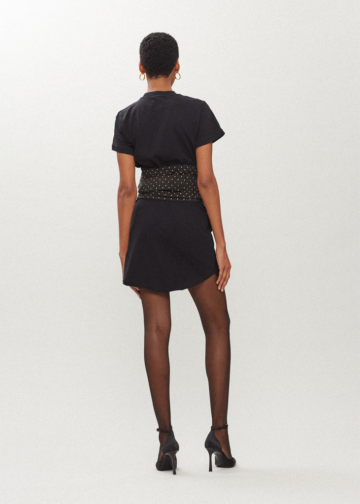 Black Lea Dress Crafted from premium cotton, this crew neck t-shirt dress boasts a curved hemline. Finished with attached denim studded belt. *Sale merchandise is exchangeable for size/color or store credit. 
