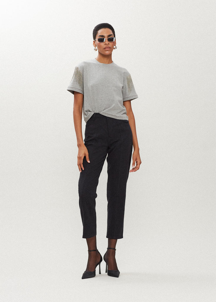 Heather Grey Liz Tee The Liz Tee is crafted from 100% premium stretch cotton and designed with a boxy cut crewneck for a contemporary look. Hand-applied silver chain fringe detail at the shoulders and a cropped fit that sits perfectly above the hip. FINAL SALE - EXCHANGE OR STORE CREDIT ONLY