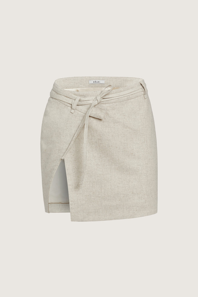 Oatmeal Louise Skirt This linen wrap mini skirt features an asymmetrical waistband and flattering cutout at the thigh.Style with The Louise Top | The Louise Shirt 