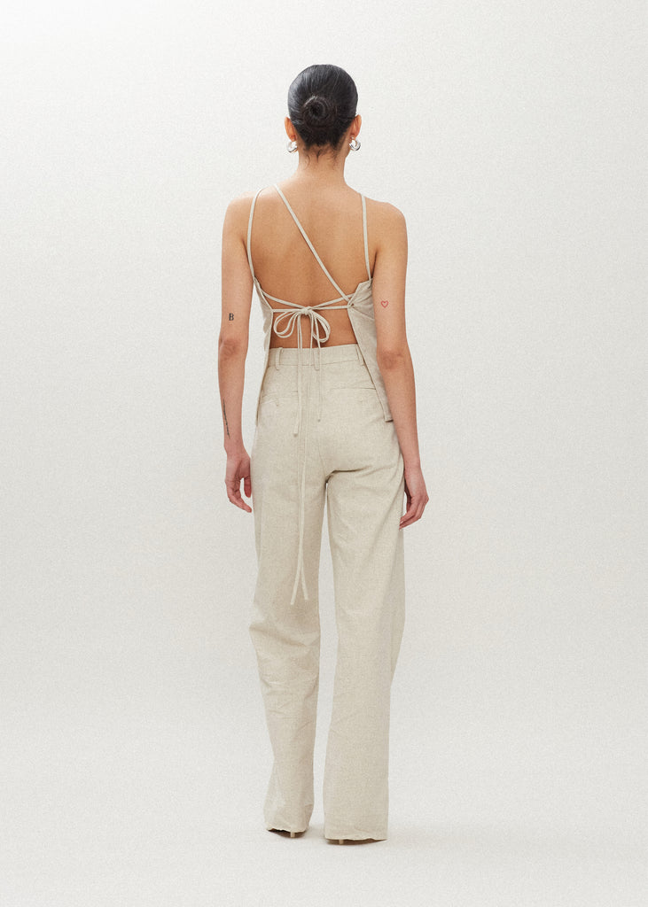 Oatmeal Louise Trouser These dual pleated mid-rise linen trousers feature a straight relaxed fit and includes a self-fabric detachable belt. 