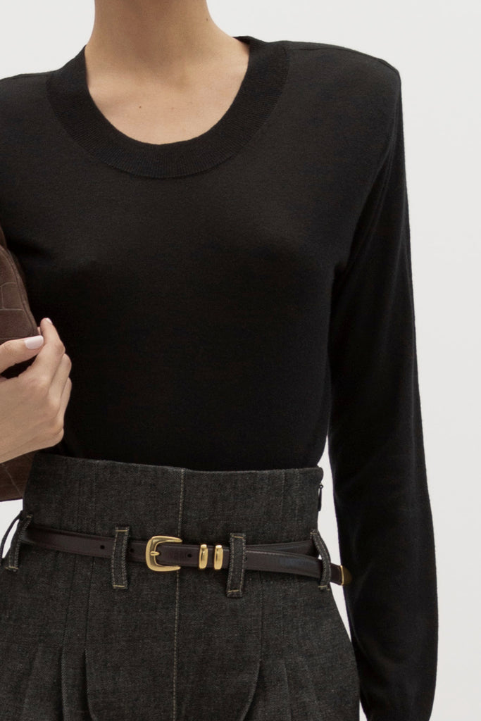 Black Margot LS Sweater -Crewneck long sleeve sweater -Crafted in a lightweight silk and cashmere blend -Single-layer ribbing at neckline, cuffs, and hem-Subtle shoulder structure with removable, self-covered shoulder pads-Interior shoulder seam with discreet snaps to remove pads  Ingryd is 5'10