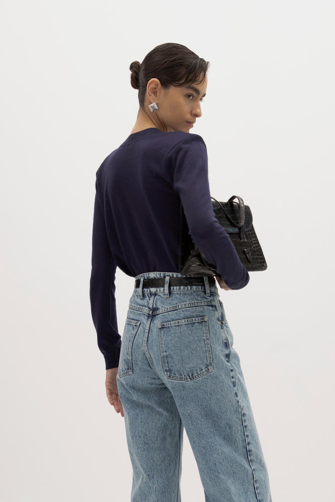 Navy Margot LS Sweater -Crewneck long sleeve sweater -Crafted in a lightweight silk and cashmere blend -Single-layer ribbing at neckline, cuffs, and hem-Subtle shoulder structure with removable, self-covered shoulder pads-Interior shoulder seam with discreet snaps to remove pads  Ingryd is 5'10