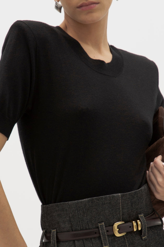 Black Margot SS Sweater -Crewneck short sleeve sweater -Crafted in a lightweight silk and cashmere blend -Single-layer ribbing at neckline, cuffs, and hem-Subtle shoulder structure with removable, self-covered shoulder pads-Interior shoulder seam with discreet snaps to remove pads  Ingryd is 5'10