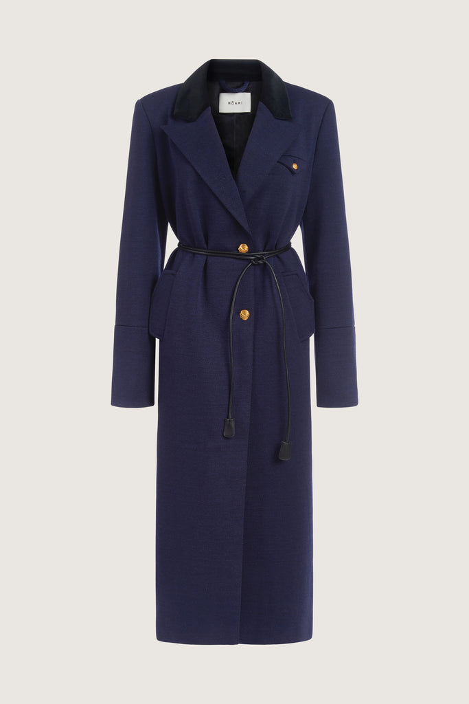 Navy Herringbone Meredith Coat This single breasted Italian wool coat is highlighted with contrasting velvet details at the collar and cuffs, providing multiple styling possibilities. It includes a 100% lambskin wrap belt and features double side vents for enhanced comfort. It is finished with RŌARI's signature gold knot buttons. Fully lined. Styled with The Meredith Trouser | The Meredith Skirt *Please reference our return & exchange policy for Sale & Archived items.