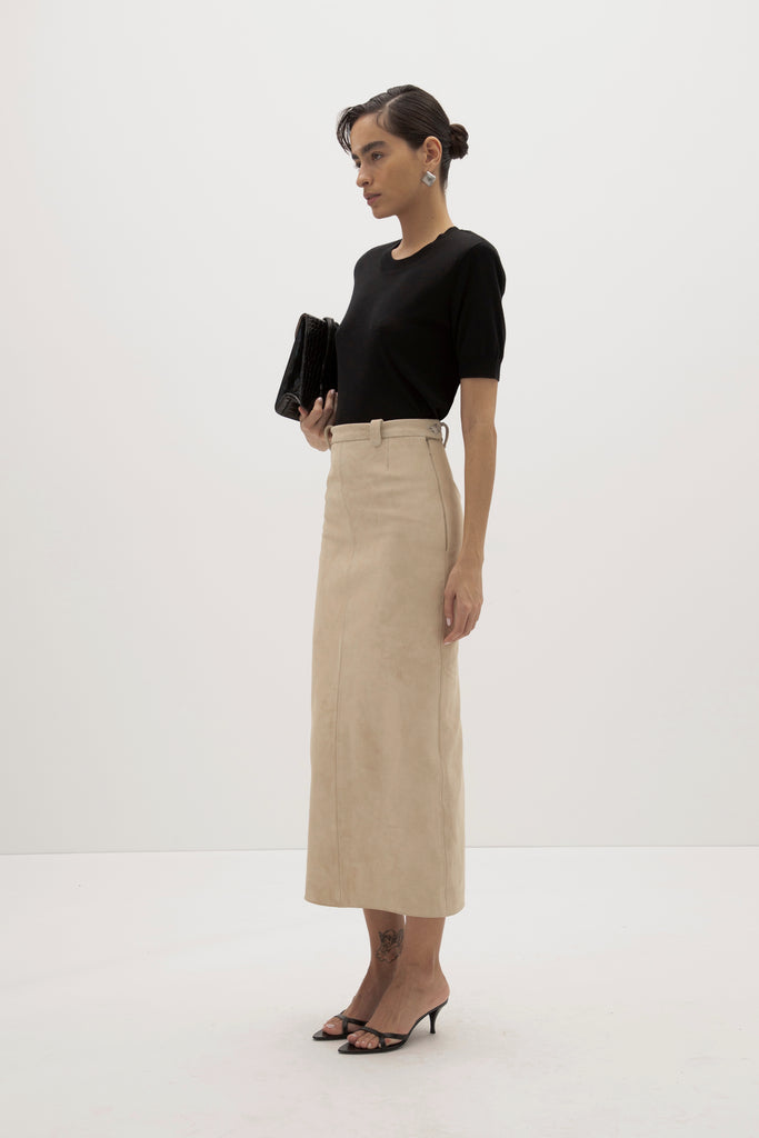 Sand Meredith Skirt -Vintage inspired pencil skirt, fitted through waist and hips-100% calf leather (suede) -Darts at front and back for a sculpted fit-Clean-finished waistband with interior facing and under-stitching-Invisible side zipper with ornate button closure at waistband-Self-doubled belt loops reinforced with strong bar tacks-Back vent for movement -Fully lined Ingryd is 5'10