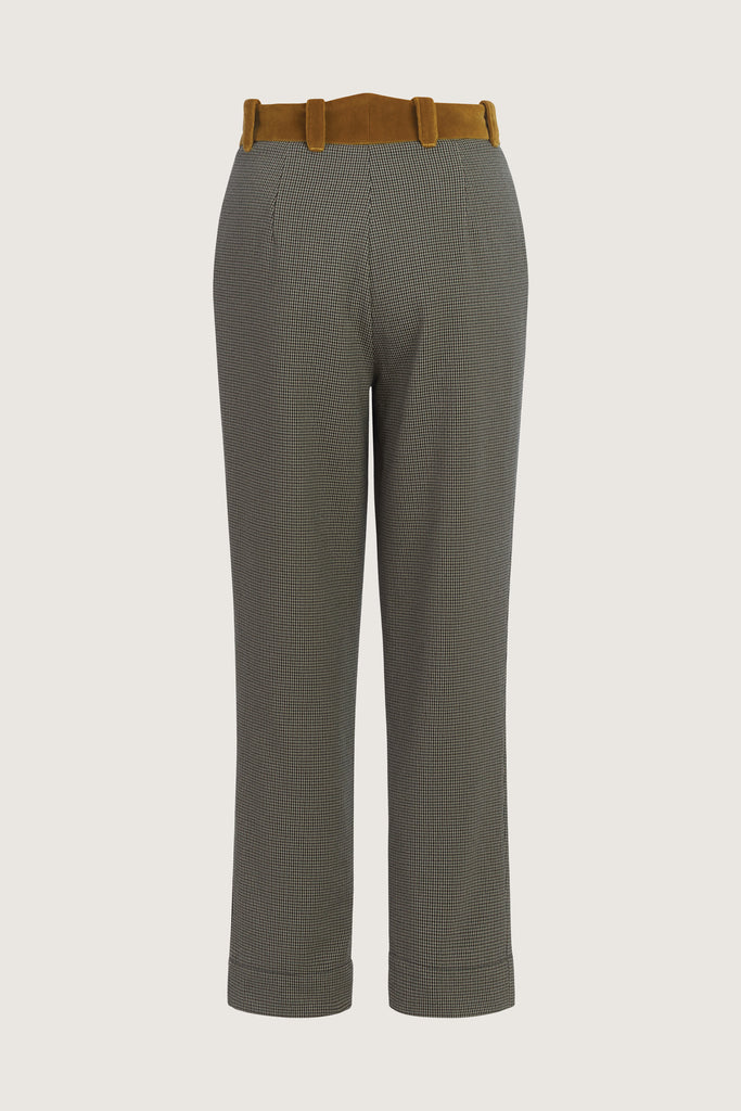 Grey Houndstooth Meredith Trouser A fresh take on the classic cigarette leg suit pant, these trousers are crafted with fine Italian virgin wool. Detailed contrasting velvet at waist. Includes a release at the bottom hem for added length if desired. Lined. Styled with The Meredith BlazerAlso available in Navy Herringbone *Please reference our return & exchange policy for Sale & Archived items.