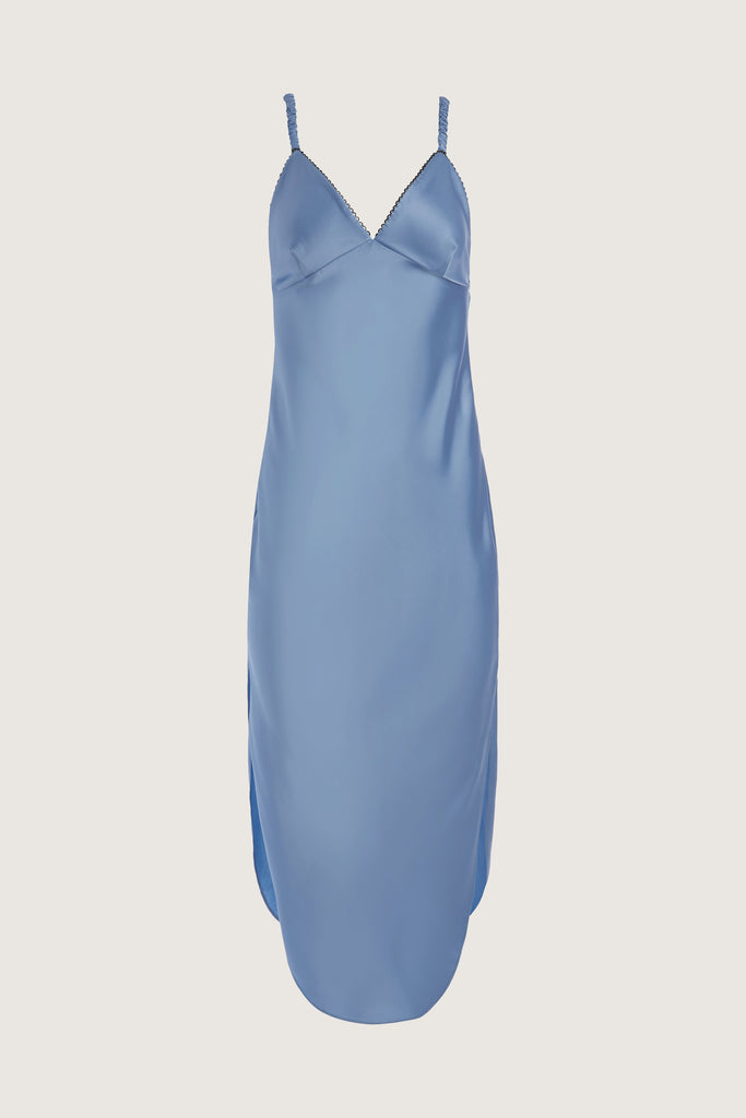 Sky Archive / Paras Dress The Paras vegan silk midi slip dress features a v-neckline with scalloped trim, bust darts, ruched elastic straps, a low cut open back, and a curved, vented hemline.This item is FINAL SALE.