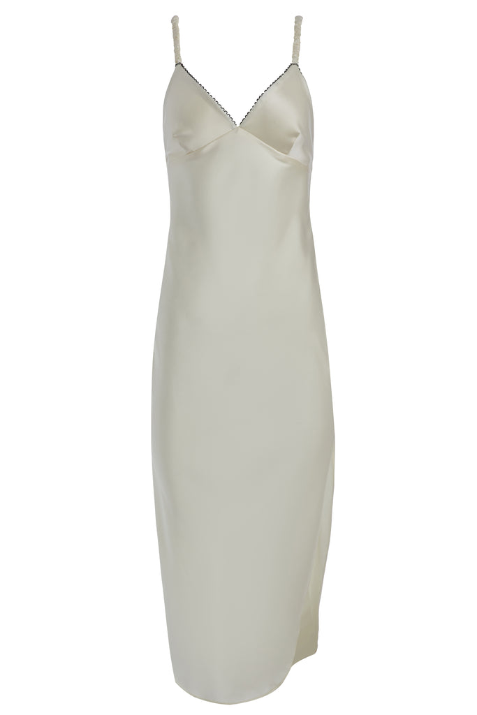 Bone Paras Dress The Paras vegan silk midi slip dress features a v-neckline with scalloped trim, bust darts, ruched elastic straps, a low cut open back, and a curved, vented hemline.*Sale merchandise is exchangeable for size or store credit. 