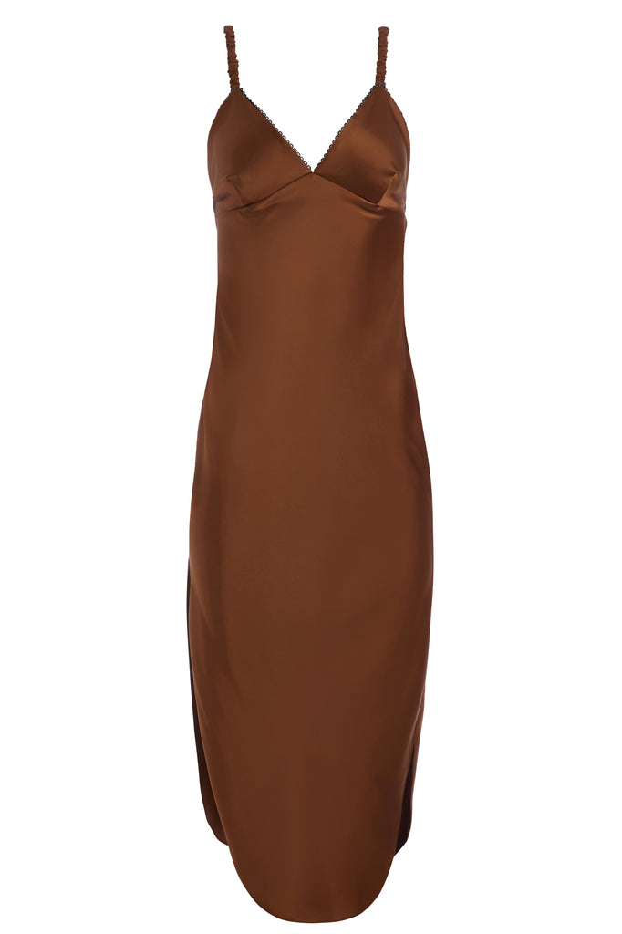 Cinnamon Paras Dress The Paras vegan silk midi slip dress features a v-neckline with scalloped trim, bust darts, ruched elastic straps, a low cut open back, and a curved, vented hemline.*Sale merchandise is exchangeable for size or store credit. 