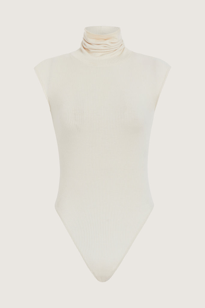 Bone Penny Bodysuit This buttery soft sleeveless ribbed turtleneck bodysuit showcases a sleek silhouette for a versatile wardrobe staple.FINAL SALE 