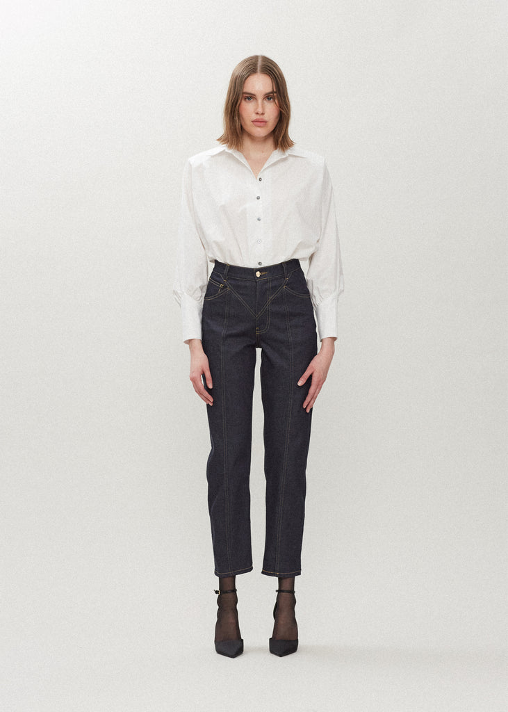 White Marna Poplin Shirt Classic tailored button-up shirt in midweight 100% Supima cotton. Featuring blousoned dolman sleeves with, Mother of Pearl buttons down center front placket, and concelead zippers at wrists with reverse V cut cuff details.
