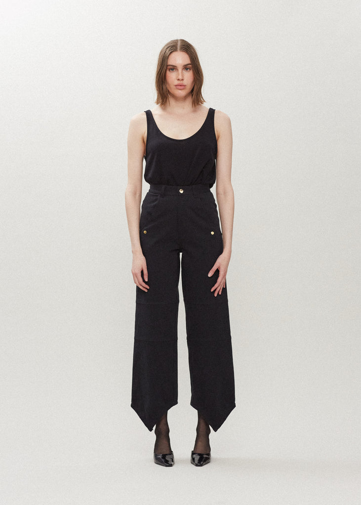 Jet Black Quinn Jean Lightweight denim with a high-rise relaxed straight leg featuring drop pockets with snap closure, v-shaped front hem, and buttons at back for option to cinch at ankle. Each pair has a branded enameled button.Styled with The Quinn Bolero | The Chloe Corset | The Zoey Tank
