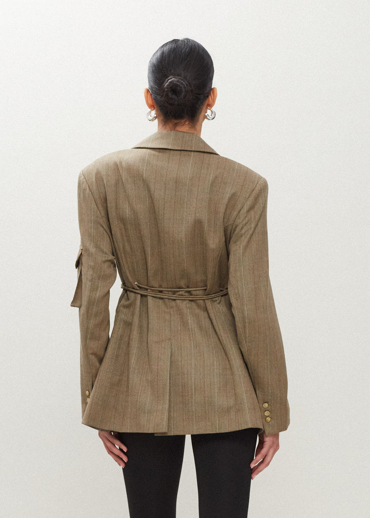 Camel Herringbone Ronnie Blazer Oversized 90's inspired blazer featuring a fixed self-fabric waist tie, cargo pocket detail on left sleeve, two standard flap pockets at hips, and custom selected horn buttons.