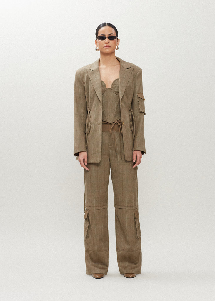 Camel Herringbone Ronnie Blazer Oversized 90's inspired blazer featuring a fixed self-fabric waist tie, cargo pocket detail on left sleeve, two standard flap pockets at hips, and custom selected horn buttons.