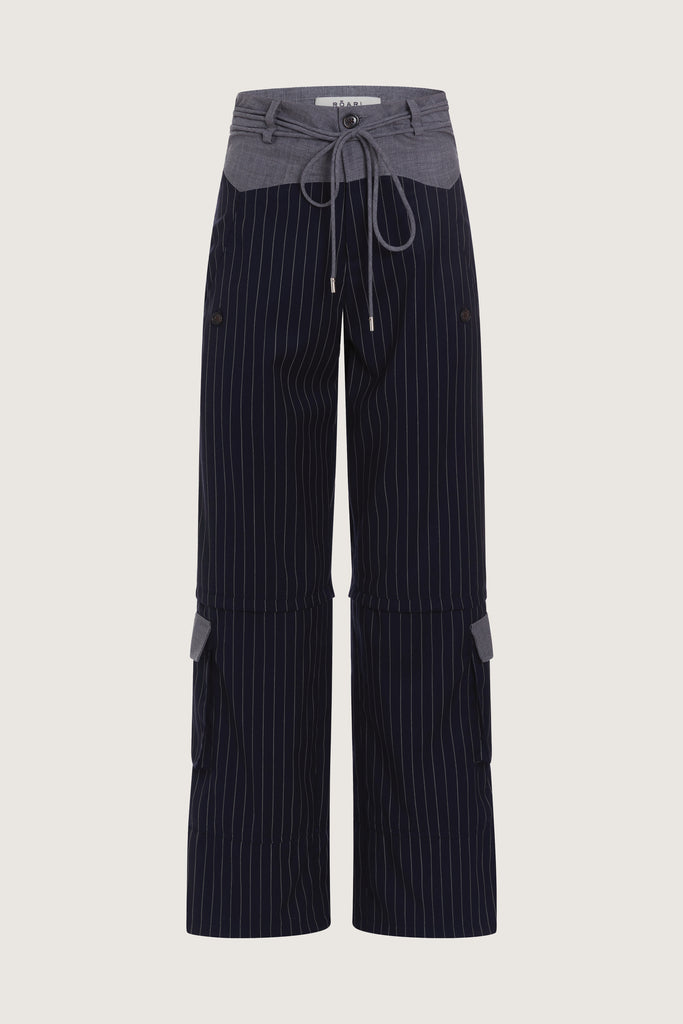 Navy Pinstripe Quinn Bolero This cropped stretch cotton denim bolero, designed to feel weightless and breathable during all seasons features an asymmetrical curved hem and light shoulder pads for a structured look.  Ana is 5'9