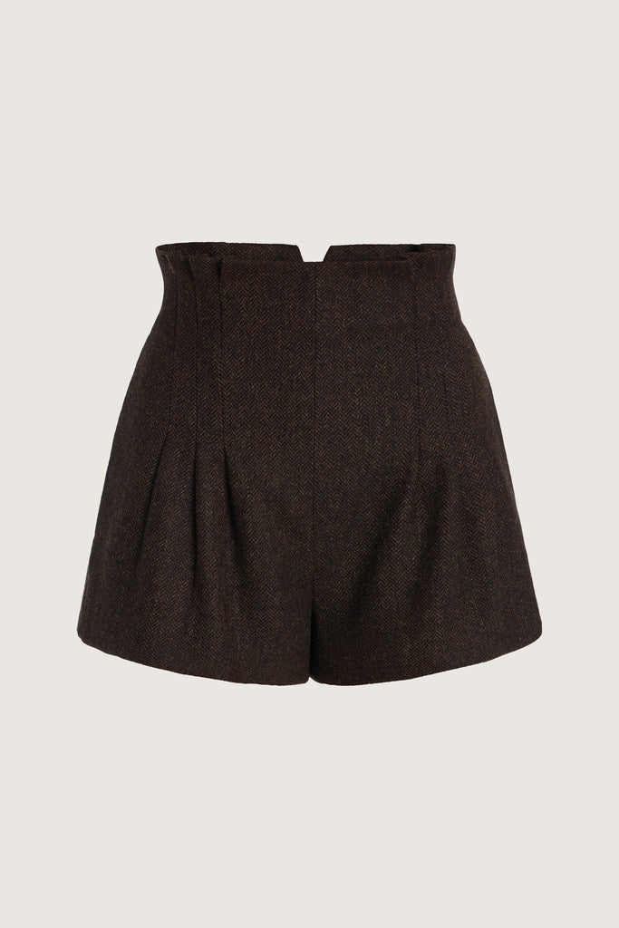 Brown Herringbone Kate Short Crafted with meticulous attention to detail for a sophisticated and contemporary look.-High-waisted paper bag short-On-seam pockets-Zip fly with hook and bar closure-Pleated front-Belt loops at back only, designed to keep your belt in place-Fully linedCrafted with Merino wool certified by the Wool Integrity Programme, ensuring farms adhere to the Five Freedoms of animal welfare. We recommend ordering your usual size.Styled with the Camilo Jacket & Zoey Tank