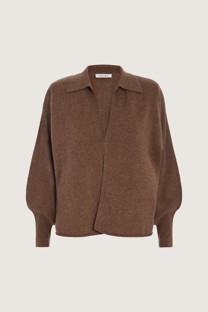 Brown Nico Shirt A seamless blend of comfort, style, and conscious sourcing, creating a modern essential you'll reach for again and again. -Collared open cardigan-Single hook and eye closure-Rib knit collar-Tailored ribbed cuffs-Dolman sleeves-Hip length-Rolled bottom hem-Self covered removable shoulder pads🐑 Made with Good Cashmere Standard® wool to support the welfare of cashmere goats We recommend ordering your usual size.Styled with the Beverly Trouser
