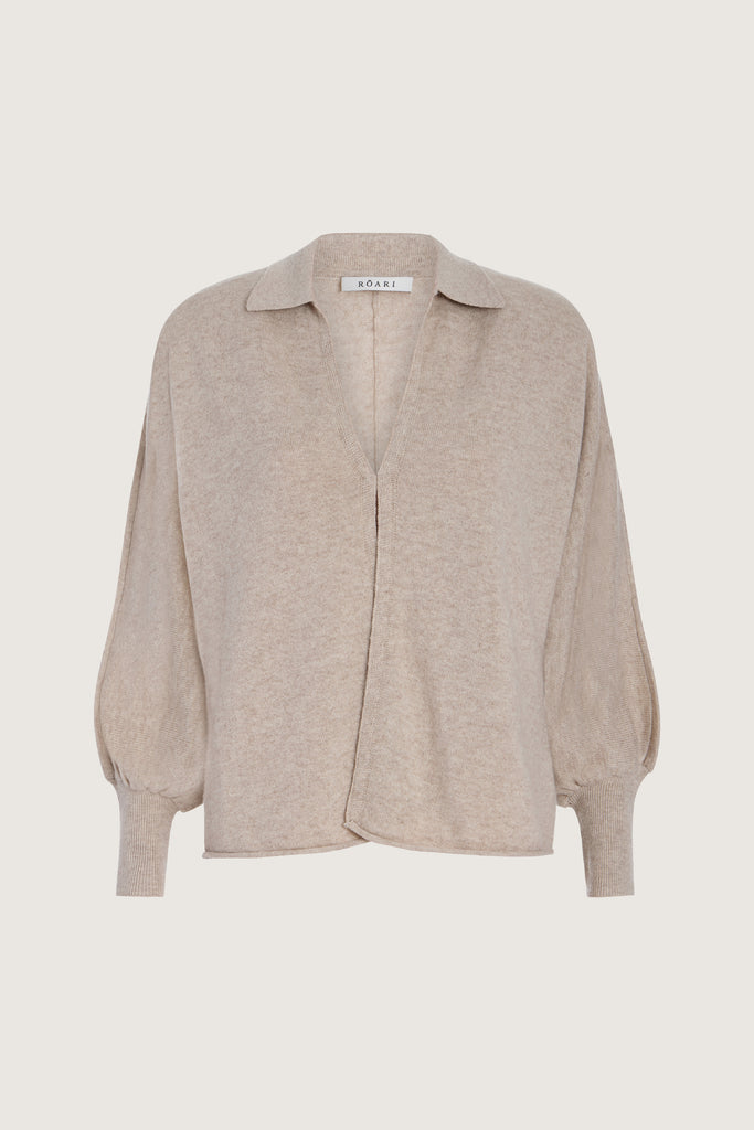 Oatmeal Nico Shirt A seamless blend of soft comfort, style, and conscious sourcing, creating an essential you'll reach for again and again. -Collared open cardigan-Single hook and eye closure-Rib knit collar-Tailored ribbed cuffs-Dolman sleeves-Hip length-Rolled bottom hem-Self covered removable shoulder pads🐑 Made with Good Cashmere Standard® wool to support the welfare of cashmere goats We recommend ordering your usual size.Styled with the Beverly Trouser