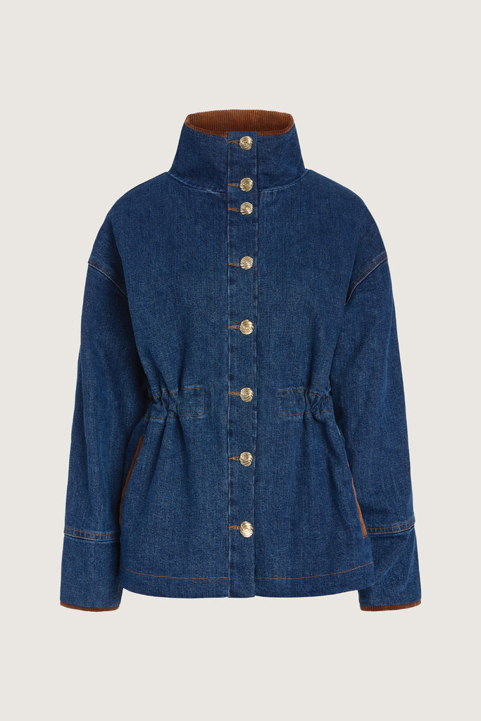 Medium Indigo Torrey Jacket A corduroy collar and gold buttons elevate this classic silhouette, while a drawcord waist lets you personalize the fit. Perfect for layering. -Premium Japanese denim-Cinched-waist jacket-Corduroy-faced collar-Funnel neck-Drawcord tunnel at waist-Welt pockets at front-Self-fabric placket with gold knot buttons-Corduroy faced cuff for option to roll-Flannel lined interior♻️ Environmentally conscious: Made with up-cycled Japanese denim that is produced with reduced CO2 emissions and water-conserving processes. We recommend ordering your usual size.Styled with the Torrey Jean & Olivia Turtleneck  