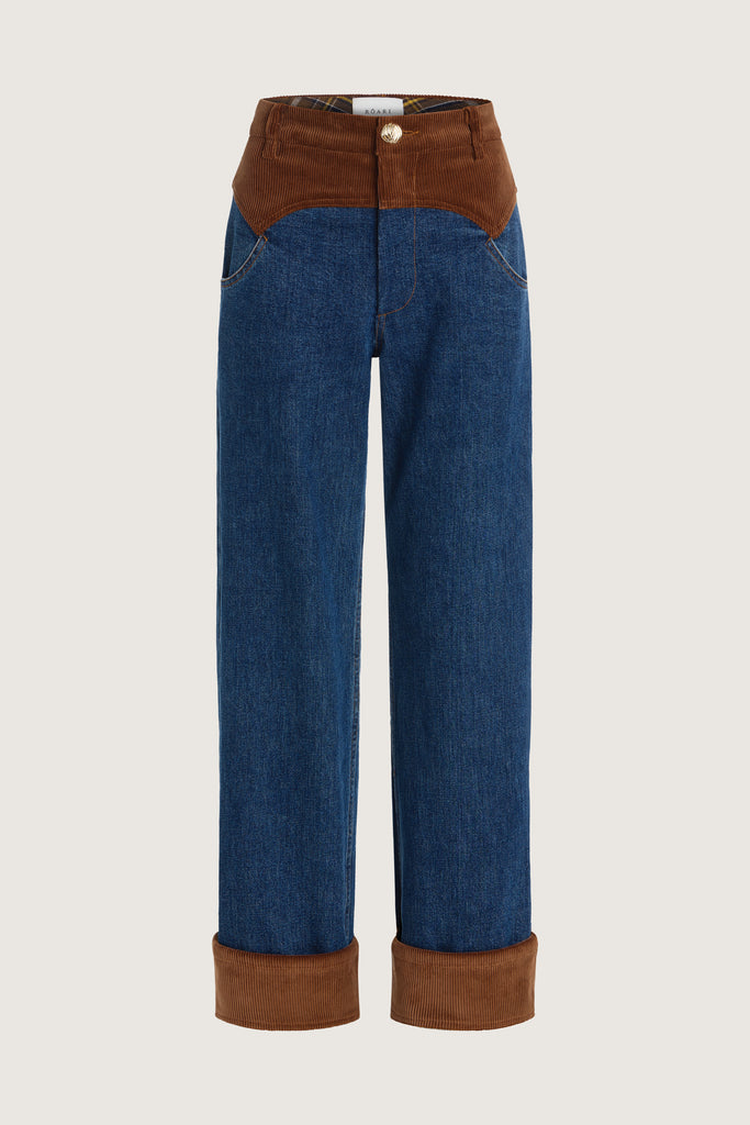 Medium Indigo Torrey Jean Featuring combination fabrics and crafted from premium Japanese denim, these novelty pants elevate the classic wide-leg silhouette with unexpected details.-Premium Japanese denim -Signature corset style waistband in contrasting corduroy fabric -Wide leg-Flannel-lined at waist -Corduroy faced cuffs at bottom hem -Pockets at front and back-Gold knot button closure -Zip-fly ♻️ Environmentally conscious: Made with up-cycled Japanese denim that is produced with reduced CO2 emissions and water-conserving processes. We recommend ordering your usual size.Styled with the Torrey Jacket & Olivia Turtleneck 