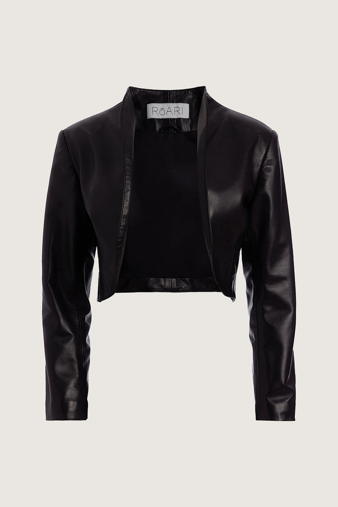 Black Archive / Saint Bolero This cropped bolero-style jacket is cut from luxurious Italian leather. It features an open front, internal zip-pocket, and shoulder pads for added structure. *Please reference our return & exchange policy for Sale & Archived items.