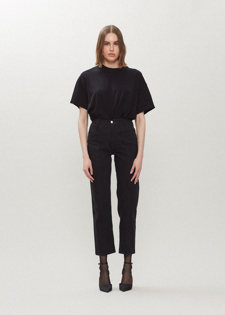 Jet Black Sarah Stretch Jean Vintage inspired high-rise fit with a relaxed straight-leg in a lightweight denim, cropped ankle length and seams down the front. Each hand-finished pair has a branded enameled button. Made in New York. Styled with The Zoey Tee | The Sasha Stretch Bolero | The Chloe Corset