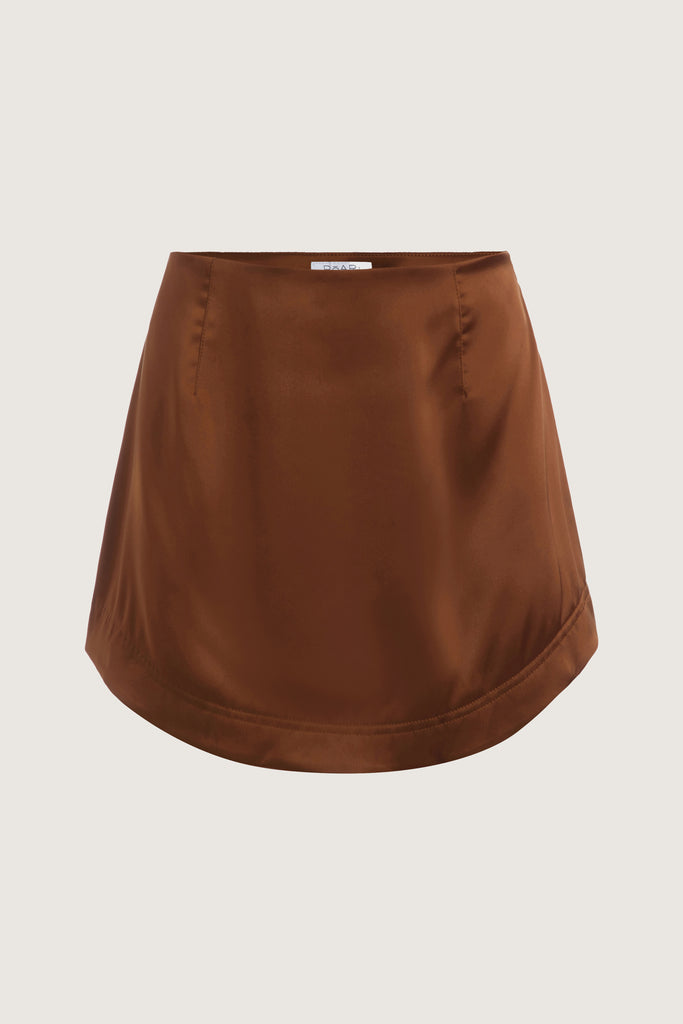 Cinnamon Stella Skirt This vegan silk mini skirt features a flattering curved front and back. Complete with a concealed side zipper and hook and eye closure. All items marked down are FINAL SALE.