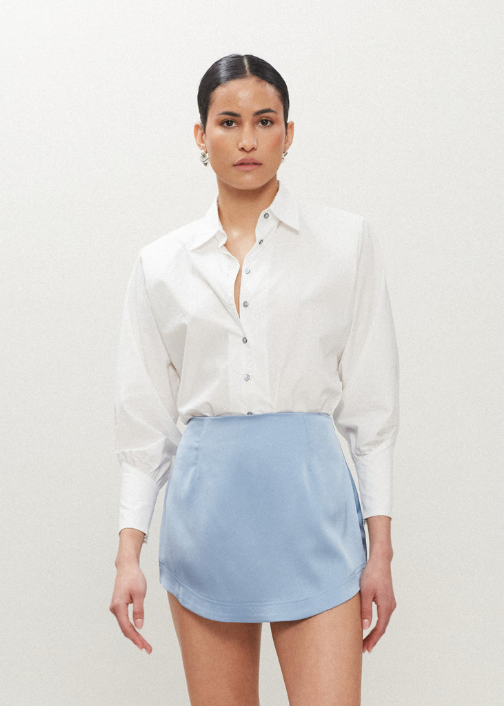 Sky Stella Skirt This vegan silk mini skirt features a flattering curved front and back. Complete with a concealed side zipper and hook and eye closure.  FINAL SALE - EXCHANGE OR STORE CREDIT ONLY