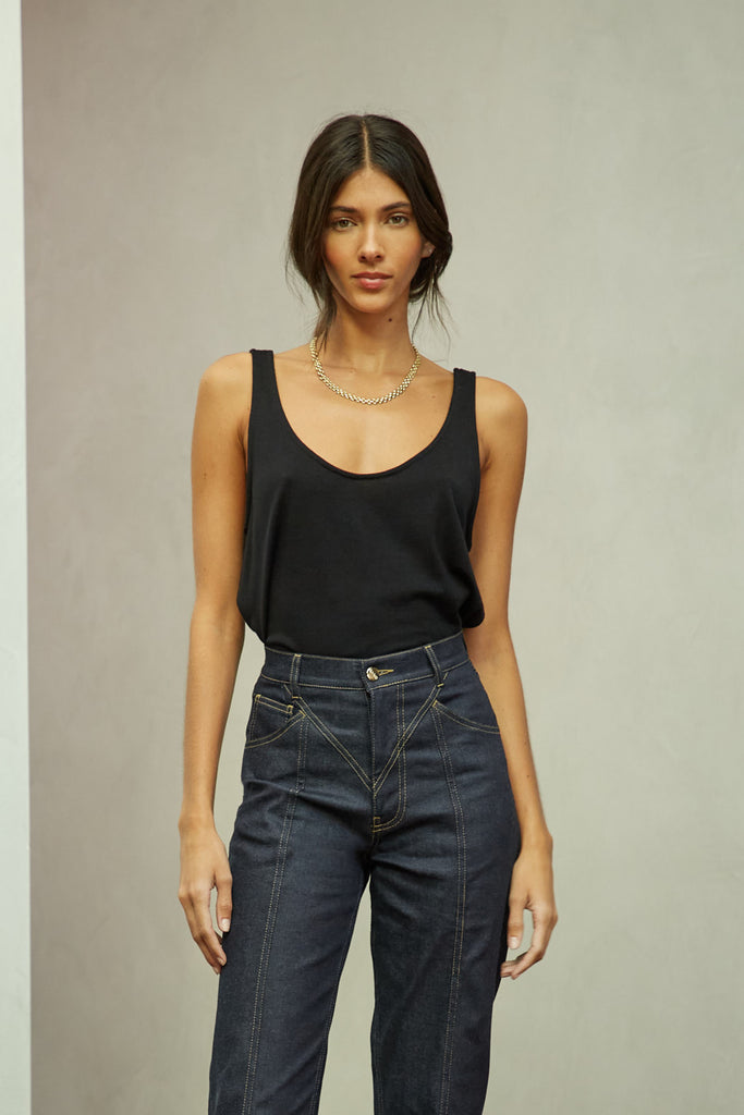 Black Zoey Tank This tank top crafted from premium merino wool features a plunging scoop neckline, low draped back and a lightly sheer finish.Style with The Sarah Stretch Jean