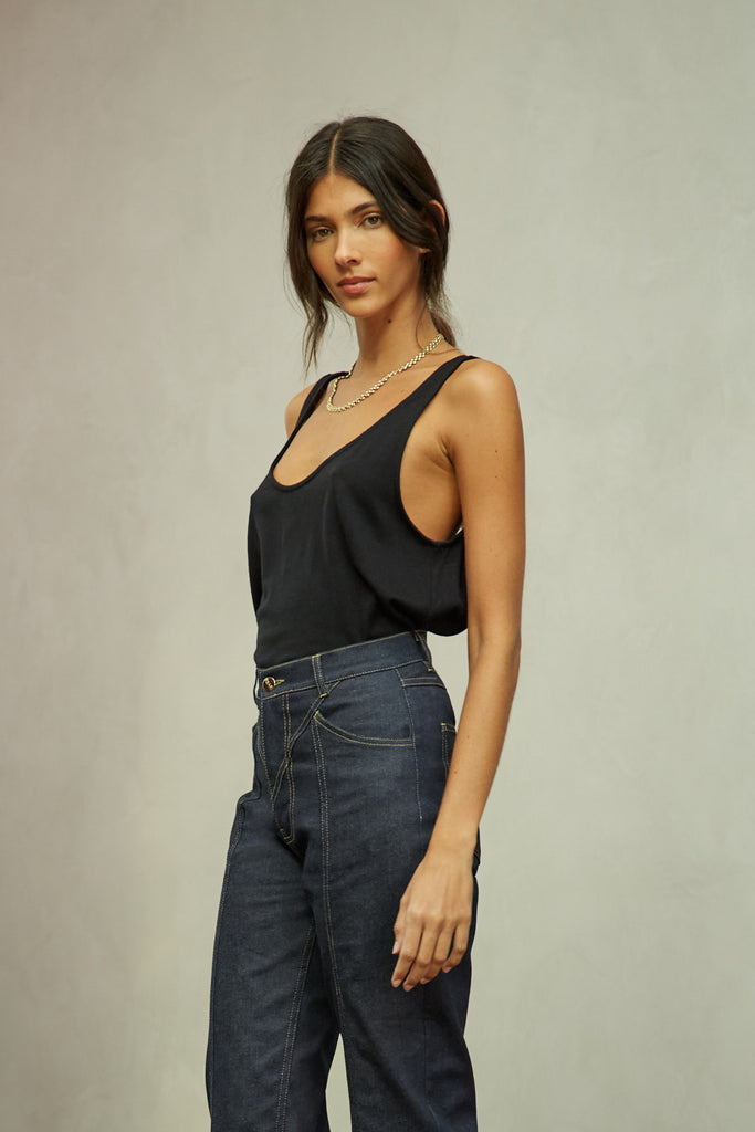 Black Zoey Tank This tank top crafted from premium merino wool features a plunging scoop neckline, low draped back and a lightly sheer finish.Style with The Sarah Stretch Jean