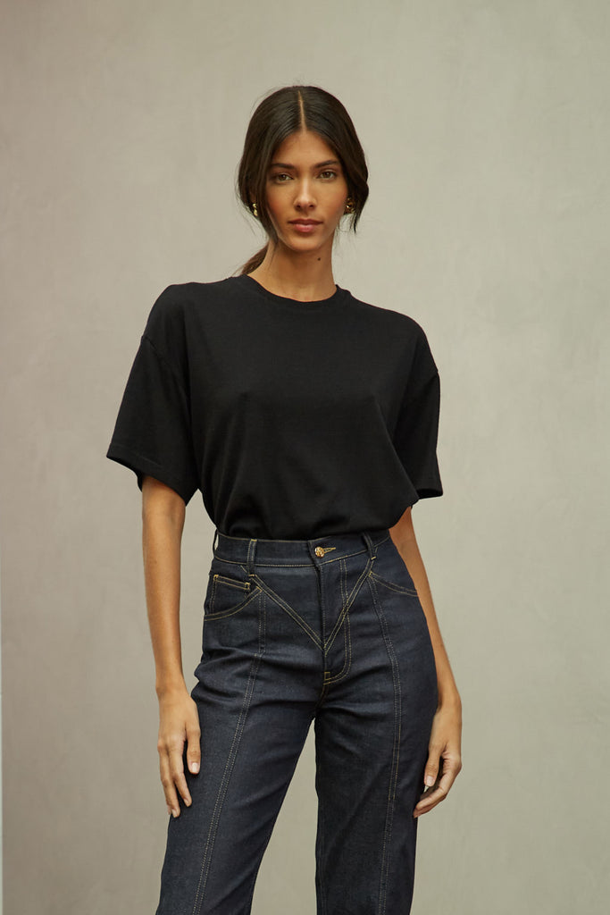 Black Zoey Tee This tee crafted from premium merino wool features an oversized relaxed silhouette and a lightly sheer finish.Style with The Sarah Stretch Jean